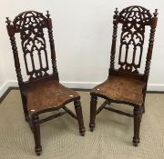 A pair of Victorian oak panel seated hal