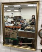 A modern beaded and swept framed rectang