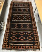 A Kelim rug, the central panel set with