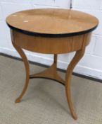 An oak and ebonised occasional table in