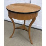 An oak and ebonised occasional table in