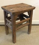 A 19th Century Chinese elm stool, the si