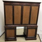 A mahogany side cabinet, the moulded den