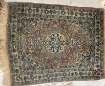 A vintage Kashan rug, the central panel