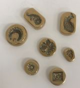 A collection of seven brass moulds, prob