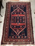 A Turkoman rug, the central panel set wi