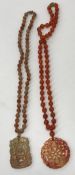 A Chinese agate bead necklace with carve