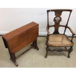 An early 20th Century oak and beech caned low elbow chair, 82 cm high,