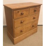 A Victorian pine chest of two short over three long drawers with turned knob handles,