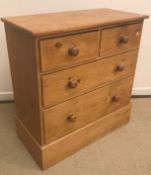 A Victorian pine chest of two short over three long drawers with turned knob handles,