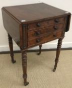 A Victorian mahogany drop-leaf work table with two drawers as three to front,