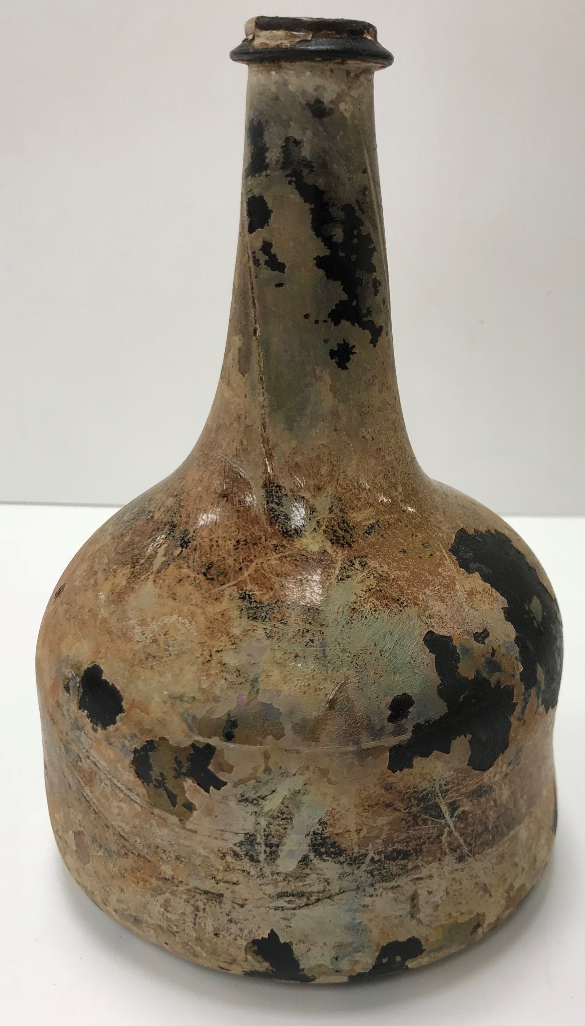A mid 18th Century English black glass mallet-shaped wine bottle, - Image 3 of 33
