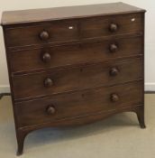 A Victorian mahogany square front chest of two short over three long graduated drawers with turned