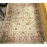 A Chinese superwash type rug of rounded rectangular form,