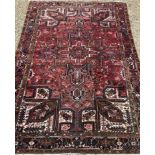 A large Heriz rug,