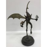 A modern verdigris and gilt bronze figure of a pixie, signed to base "Juno", 36 cm high,