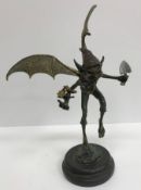 A modern verdigris and gilt bronze figure of a pixie, signed to base "Juno", 36 cm high,