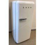 A cream coloured SMEG refrigerator,