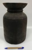 A wooden tribal type pot with flared rim, 18 cm diameter x 29.