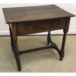 A Victorian oak single drawer side table on turned and ringed supports united by a central