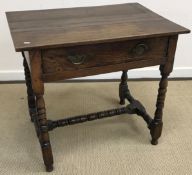 A Victorian oak single drawer side table on turned and ringed supports united by a central