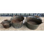 A set of three graduated vintage style pails of shallow form with wood bound handles,