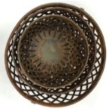 A graduated set of three metal lattice bowls with swing handles, the smallest 27.