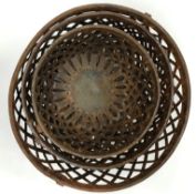 A graduated set of three metal lattice bowls with swing handles, the smallest 27.