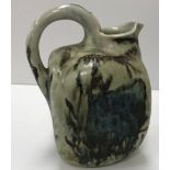A late 19th Century Martin Brothers pottery jug of square form with fish decoration,