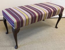 A modern upholstered stool with striped upholstery in the 19th Century taste,
