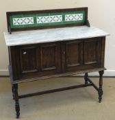 A collection of three marble topped tile back washstands,