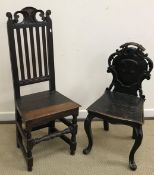 A pair of oak Wainscott type chairs, the backs with scrolling and hare bell decoration,