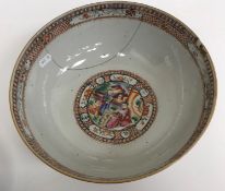 An 18th Century Kangxi palette polychrome decorated bowl with all over figural panel decoration