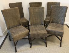 A matched set of five Lusty caned dining chairs and a similar Lloyd Loom chair,