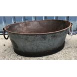 Two galvanised oval planters with twin handles,