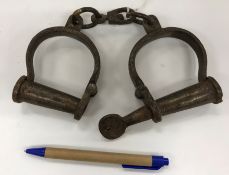 A pair of vintage style metal decorative handcuffs