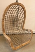 A mid 20th Century cane work hanging tub chair,