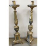 A pair of 19th Century giltwood and gesso torchères, in the Italianate taste,