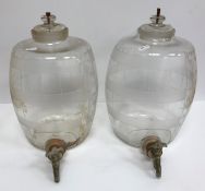 A pair of cut and frosted glass sherry barrels with side measuring gauge and plated tap, approx 33.