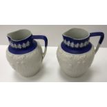 A pair of Minton blue Jasper jugs,