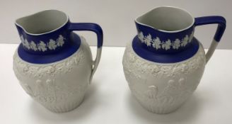 A pair of Minton blue Jasper jugs,