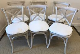 A set of six Oka style bar back Bergère dining chairs with painted grey effect frames