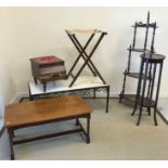 A collection of furniture to include two Edwardian Sutherland tables, a mahogany canterbury,