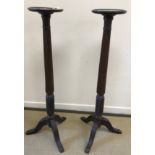 A pair of mahogany jardiniere stands,