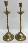 A pair of late 18th / early 19th Century bell metal travelling candlesticks,