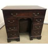 A George III mahogany kneehole desk,