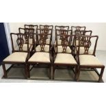 A set of twelve dining chairs in the George III Chippendale manner,