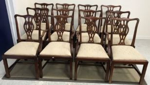 A set of twelve dining chairs in the George III Chippendale manner,