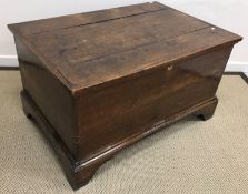 A 19th Century oak trunk / coffer, the four plank top with applied moulded edge,