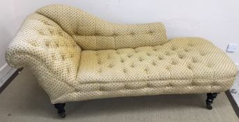 A Victorian buttoned yellow and blue upholstered chaise longue,